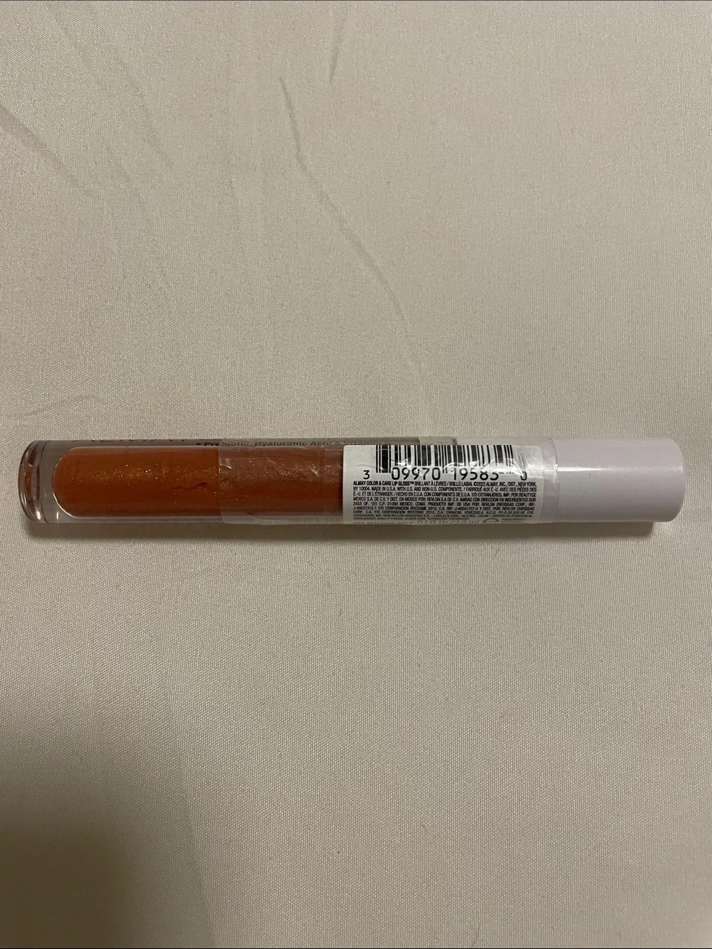 Almay Shimmering Peach-Coral Color & Care Lip Gloss